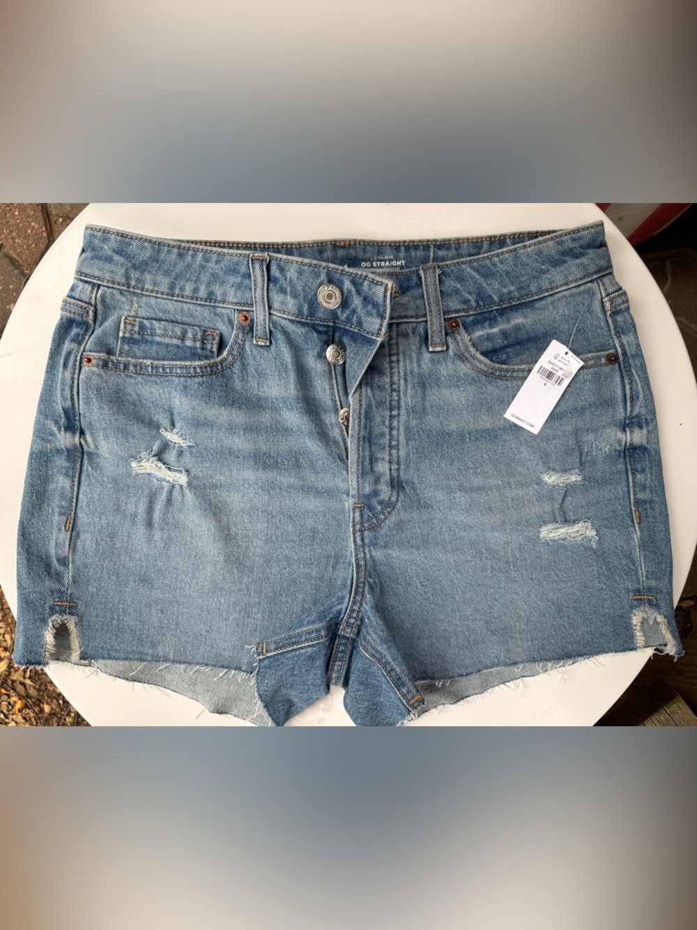 Old Navy light blue distressed denim shorts